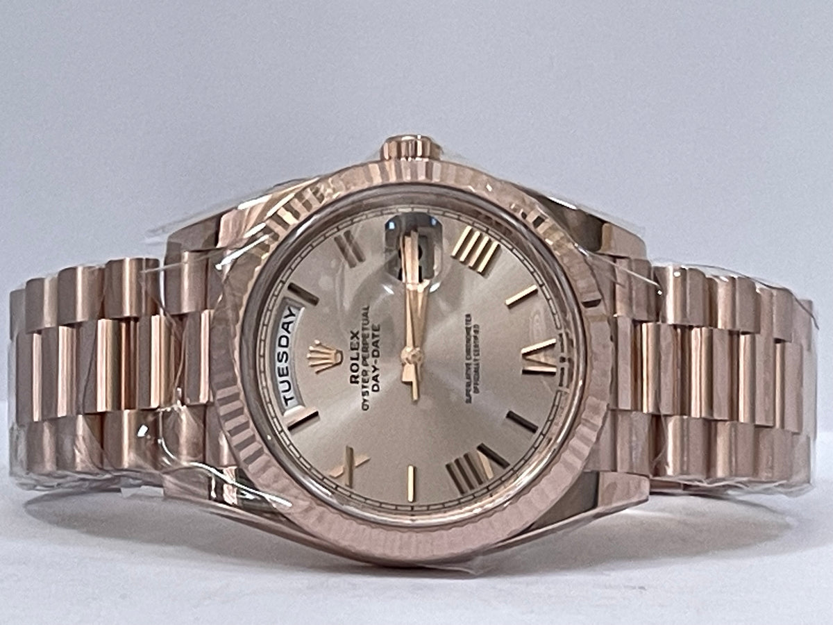 Rolex Everose Gold Day-Date 40 - 2023 - Fluted Bezel - Sundust Bevelled Roman Dial - President Bracelet - 228235