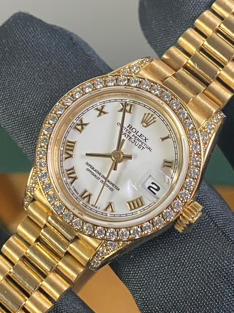 Rolex Yellow Gold Lady-Datejust - 1990 - Diamond Bezel - White Roman Dial - President Bracelet - 69158 "Crown Collection"