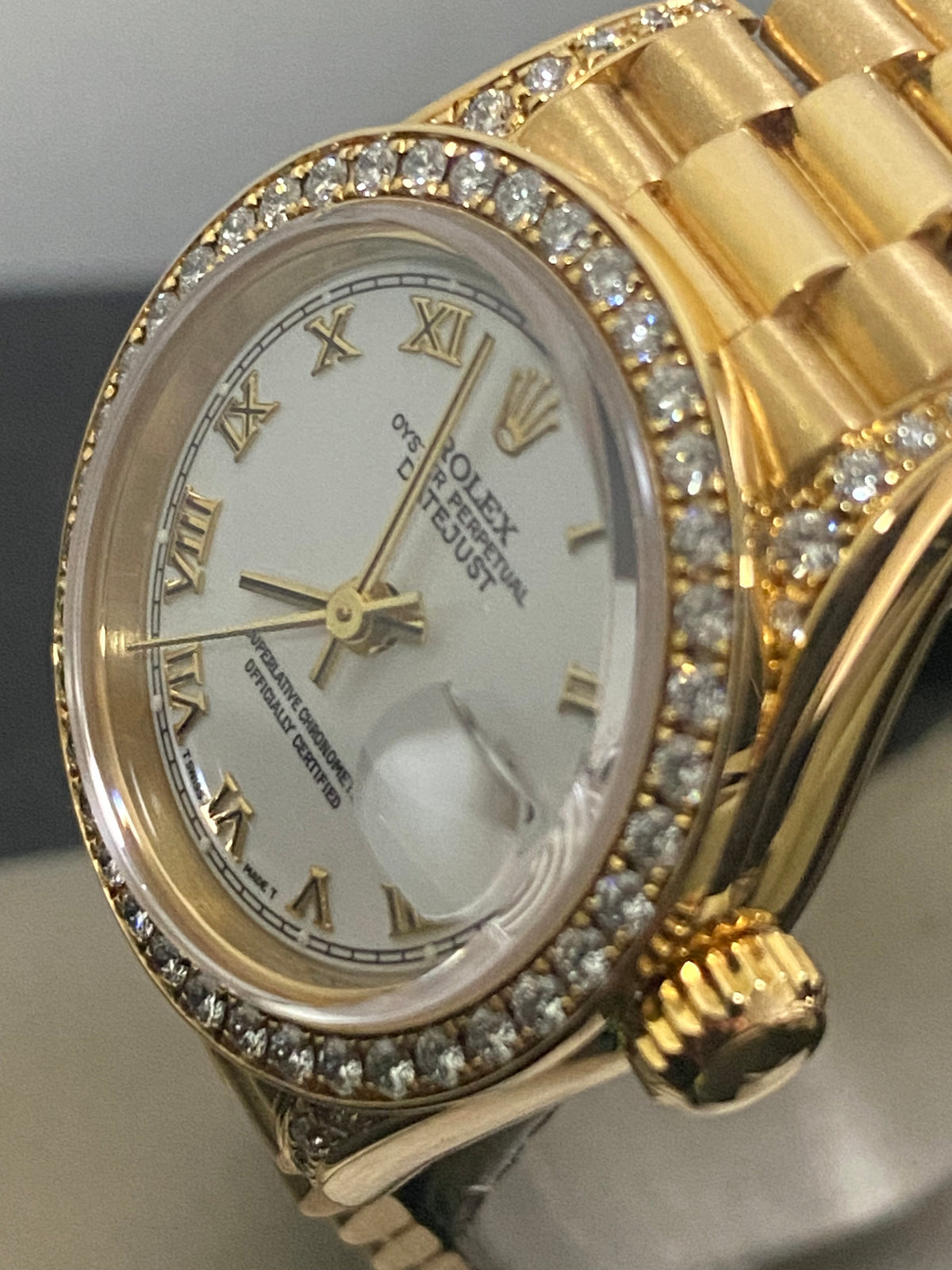 Rolex Yellow Gold Lady-Datejust - 1990 - Diamond Bezel - White Roman Dial - President Bracelet - 69158 "Crown Collection"