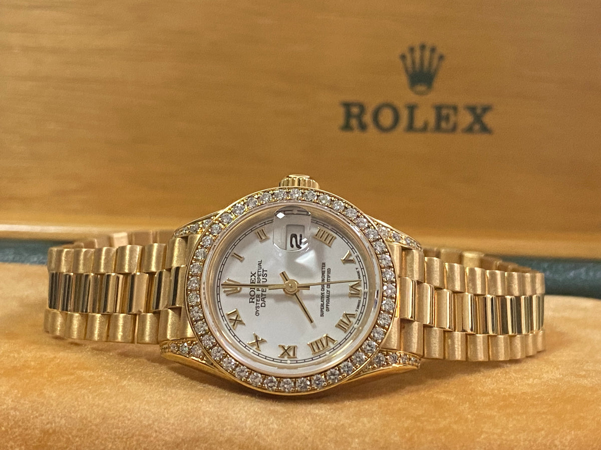 Rolex Yellow Gold Lady-Datejust - 1990 - Diamond Bezel - White Roman Dial - President Bracelet - 69158 "Crown Collection"