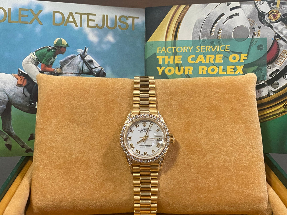 Rolex Yellow Gold Lady-Datejust - 1990 - Diamond Bezel - White Roman Dial - President Bracelet - 69158 "Crown Collection"