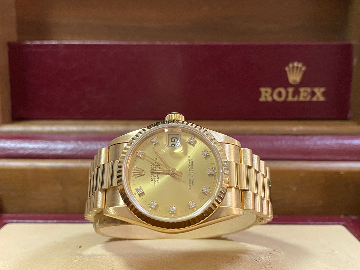 Rolex Yellow Gold Datejust 31 - L Serial - Fluted Bezel - Factory Diamond Dial - President Bracelet - 68278