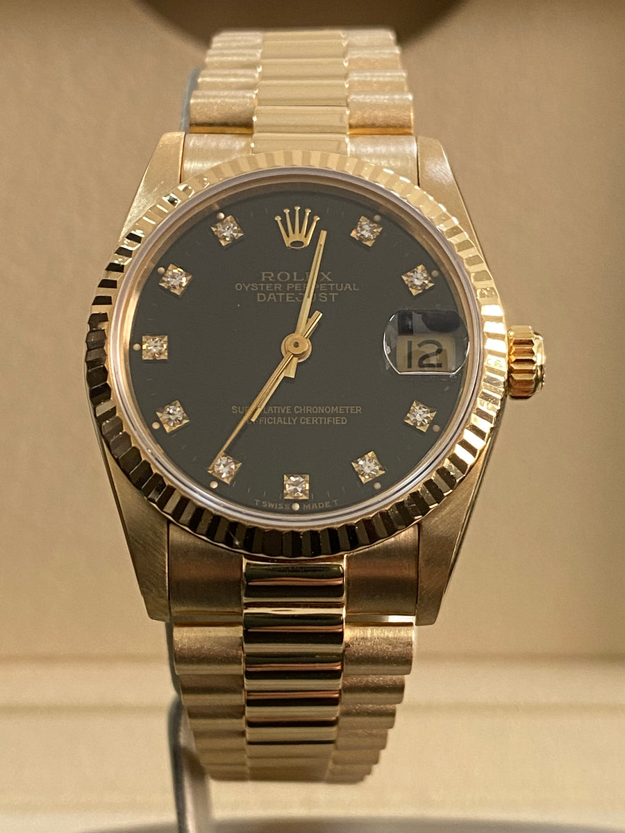 Rolex Yellow Gold Datejust 31 - L serial - Fluted Bezel - Black Diamond Dial - President Bracelet - 68278