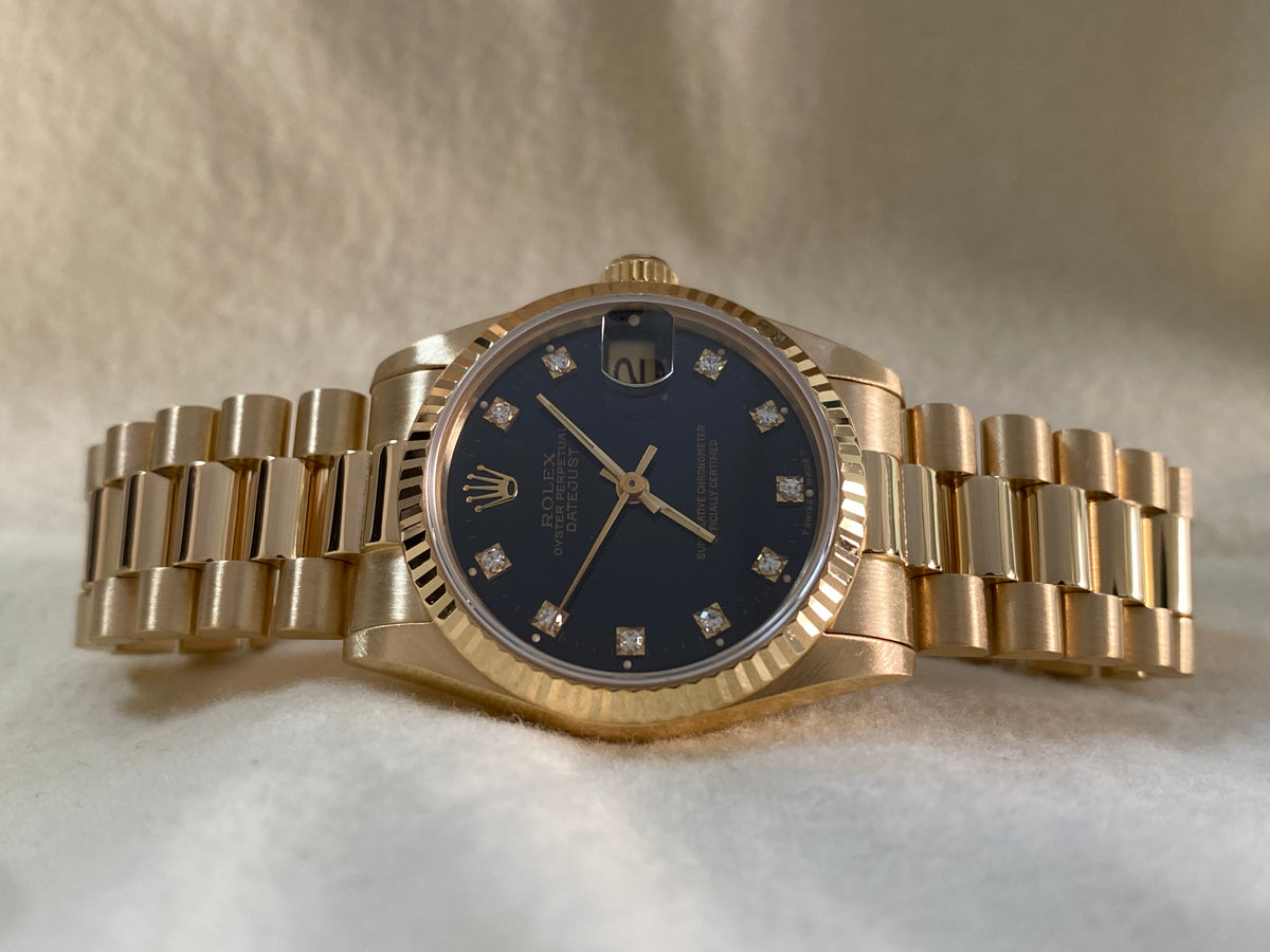 Rolex Yellow Gold Datejust 31 - L serial - Fluted Bezel - Black Diamond Dial - President Bracelet - 68278