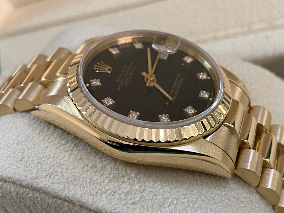 Rolex Yellow Gold Datejust 31 - L serial - Fluted Bezel - Black Diamond Dial - President Bracelet - 68278